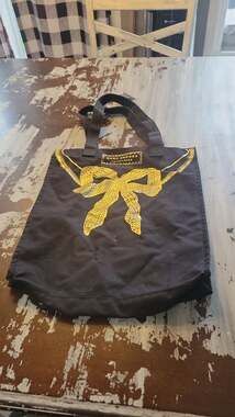 Marc Jacobs Fragrances Black Canvas Tote Bag with Gold Bow Graphic